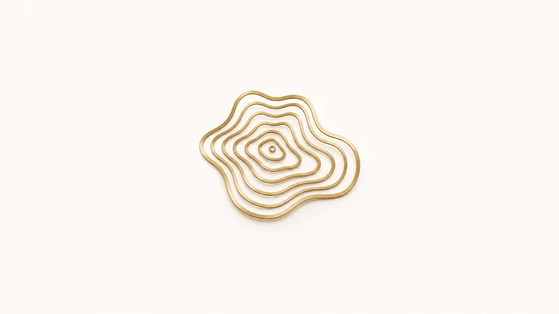 Abstract a contour map of concentric elevation lines in brushed brass motif centred on a seamless pale off-white studio background, generous empty margin for overlaid branding