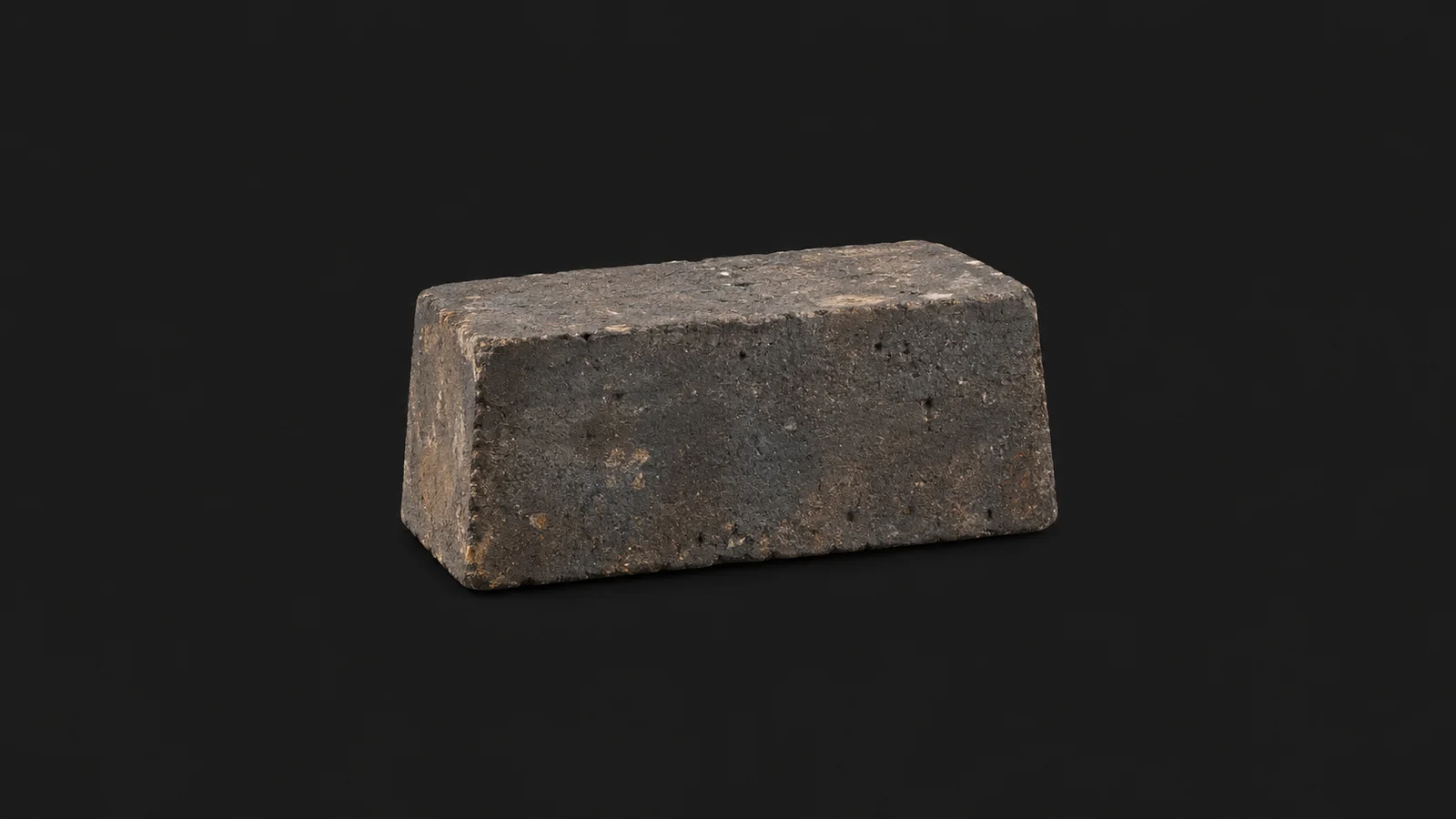 Isolated a foundry ladle refractory lining brick centred on a seamless deep charcoal near-black studio background, generous empty margin on every side for overlaid branding