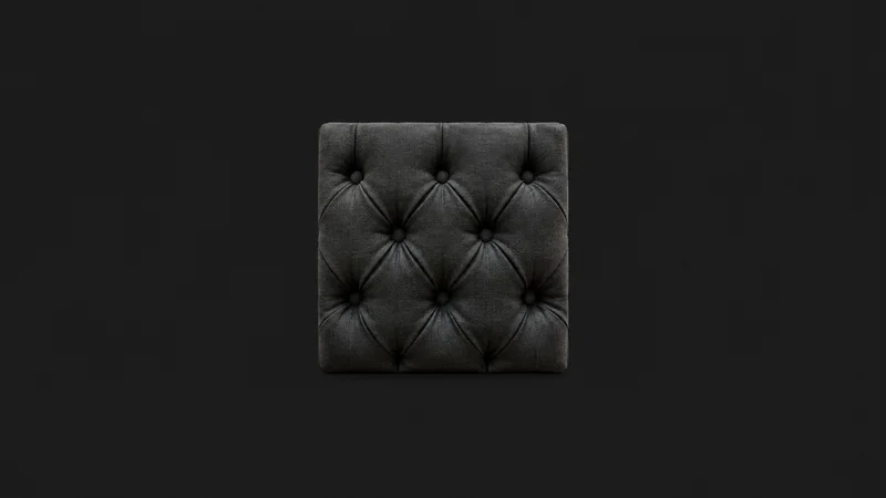 Abstract a diamond pattern of deep-buttoned upholstery folds motif centred on a seamless deep charcoal near-black studio background, generous empty margin for overlaid branding