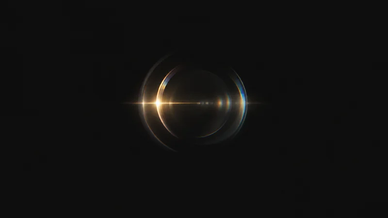 Abstract a sweep of lens-flare arcs across a dark field motif centred on a seamless deep charcoal near-black studio background, generous empty margin for overlaid branding