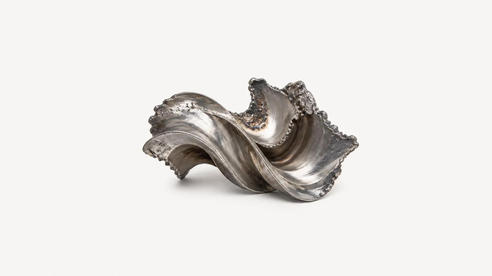 Abstract ripples of molten metal frozen mid-pour motif centred on a seamless pale off-white studio background, generous empty margin for overlaid branding