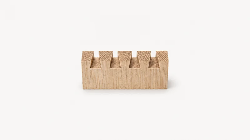 Abstract a staggered row of dovetail pins in end grain motif centred on a seamless pale off-white studio background, generous empty margin for overlaid branding