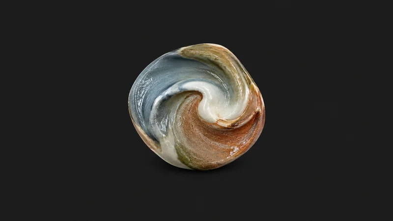 Abstract a swirl of blended glaze colours pooling on a curved surface motif centred on a seamless deep charcoal near-black studio background, generous empty margin for overlaid branding