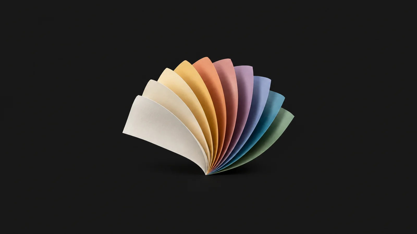 Abstract a fan of paper sheets curling in a graduated spectrum motif centred on a seamless deep charcoal near-black studio background, generous empty margin for overlaid branding