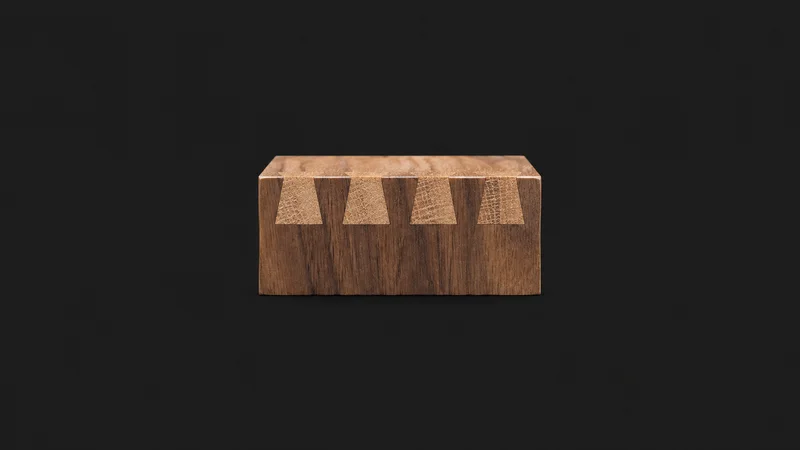 Abstract a staggered row of dovetail pins in end grain motif centred on a seamless deep charcoal near-black studio background, generous empty margin for overlaid branding