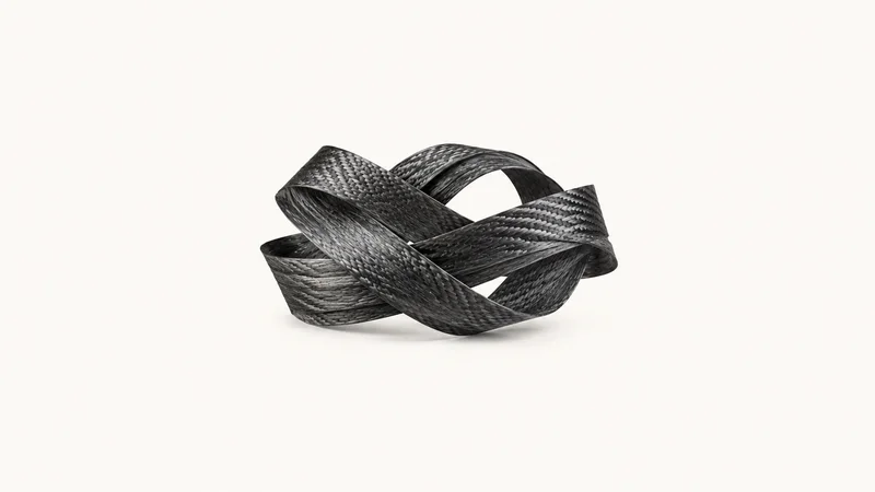 Abstract a swept carbon-weave pattern of overlapping fibre tows motif centred on a seamless pale off-white studio background, generous empty margin for overlaid branding