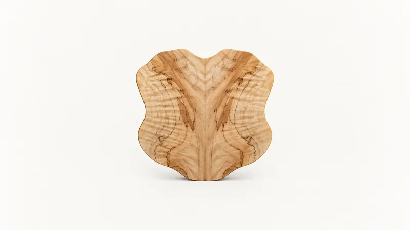 Abstract a bookmatched wood-grain mirror image radiating from a centre seam motif centred on a seamless pale off-white studio background, generous empty margin for overlaid branding