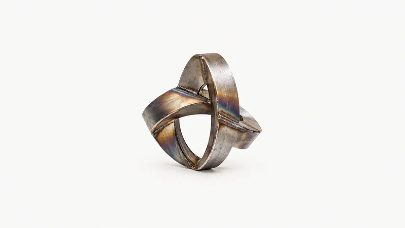 Abstract a heat-tint rainbow spreading across welded steel motif centred on a seamless pale off-white studio background, generous empty margin for overlaid branding