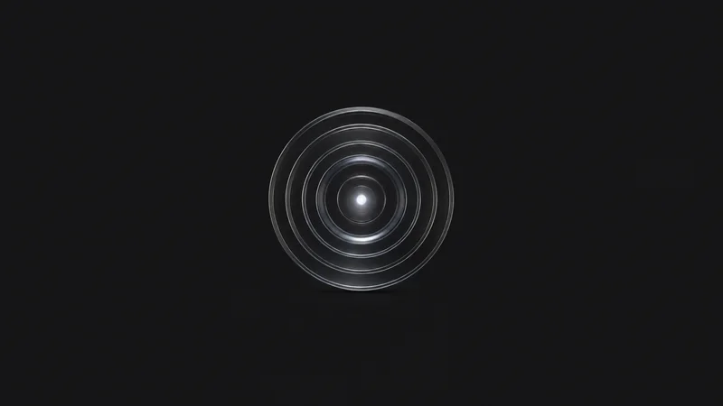 Abstract concentric pulse rings radiating from a single bright point motif centred on a seamless deep charcoal near-black studio background, generous empty margin for overlaid branding