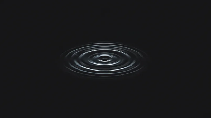 Abstract concentric ripples spreading across dark still water motif centred on a seamless deep charcoal near-black studio background, generous empty margin for overlaid branding