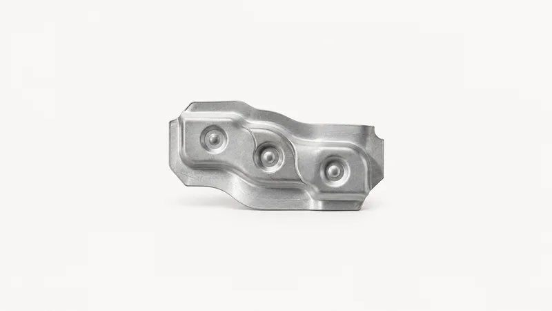 Abstract overlapping spot-weld dimples on a pressed steel sheet motif centred on a seamless pale off-white studio background, generous empty margin for overlaid branding