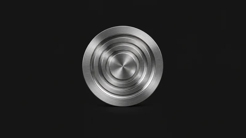 Abstract a nested set of concentric turned grooves on a polished steel disc motif centred on a seamless deep charcoal near-black studio background, generous empty margin for overlaid branding