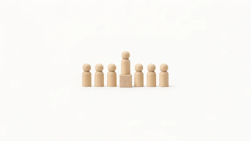 Abstract a wooden peg rising above a row of matched wooden pegs motif centred on a seamless pale off-white studio background, generous empty margin for overlaid branding