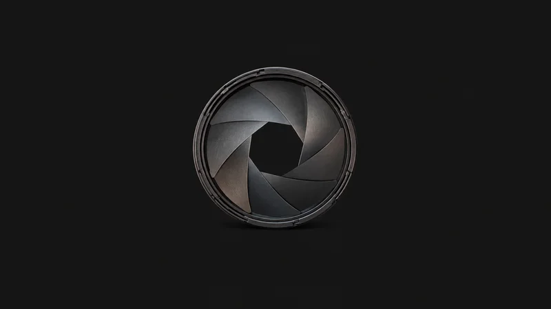 Abstract a shutter-like aperture of tinted blades opening outward motif centred on a seamless deep charcoal near-black studio background, generous empty margin for overlaid branding