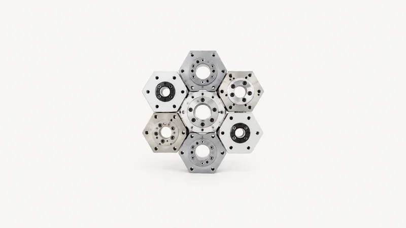 Abstract a tessellation of hexagonal robot-flange bolt patterns motif centred on a seamless pale off-white studio background, generous empty margin for overlaid branding