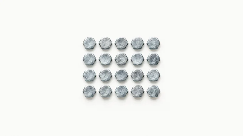 Abstract a grid of zinc-plated bolt heads motif centred on a seamless pale off-white studio background, generous empty margin for overlaid branding