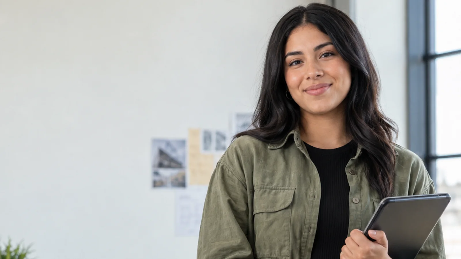 Mid-length portrait of a teenager in casual everyday clothing, professional portraits, bright daylight through the windows, plain working backdrop with copy space